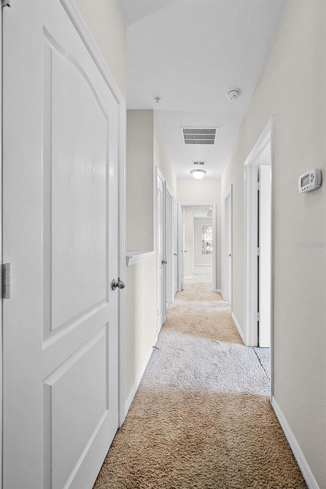 2193 Betsy Ross Ln, Saint Cloud, FL 34769 - corridor with light carpet and baseboards