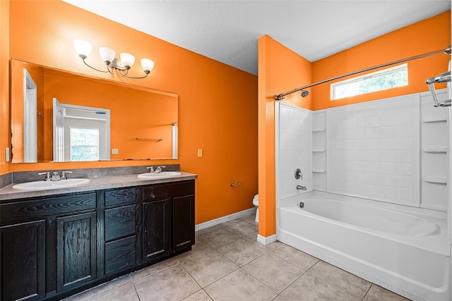 2193 Betsy Ross Ln, Saint Cloud, FL 34769 - bathroom featuring toilet, double vanity, tile patterned floors, bathing tub / shower combination, and plenty of natural light