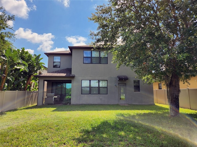 5107 Appenine Loop W, Saint Cloud, FL 34771 - rear view of property with stucco siding
