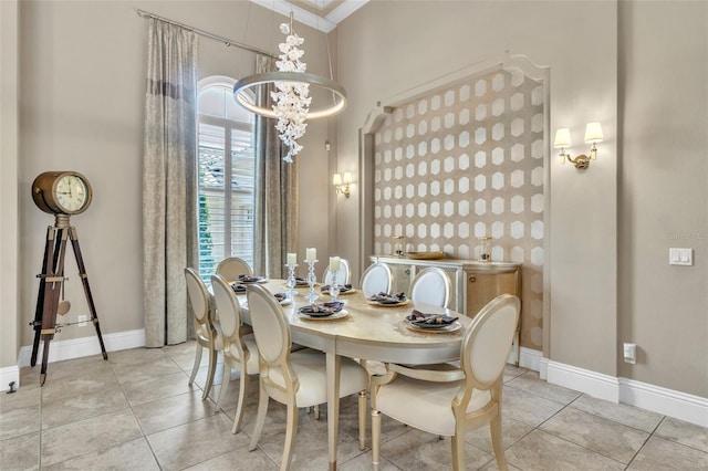 9729 Lake Hugh Dr, Gotha, FL 34734 - dining space featuring a chandelier, baseboards, and light tile patterned flooring