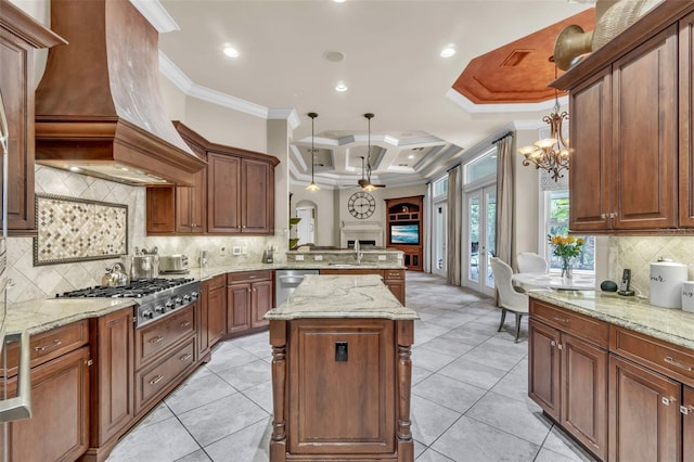 9729 Lake Hugh Dr, Gotha, FL 34734 - kitchen with stainless steel appliances, crown molding, custom range hood, coffered ceiling, and a sink