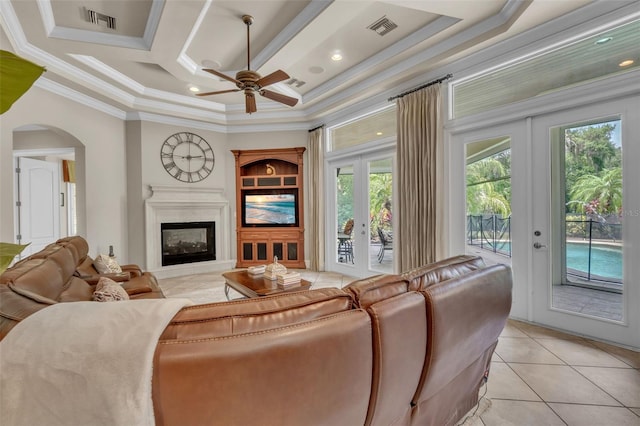 9729 Lake Hugh Dr, Gotha, FL 34734 - living area with french doors, crown molding, ceiling fan, light tile patterned flooring, and coffered ceiling