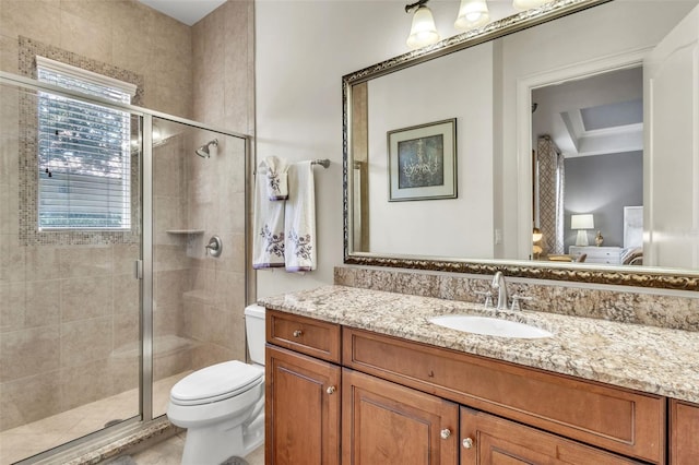 9729 Lake Hugh Dr, Gotha, FL 34734 - bathroom featuring ensuite bath, vanity, a shower stall, and toilet