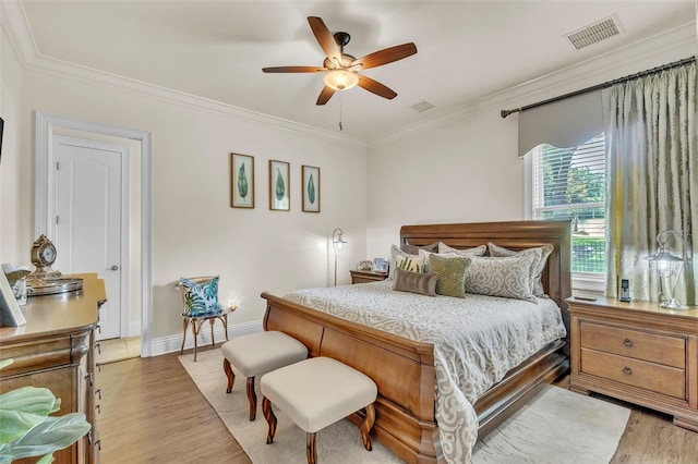 9729 Lake Hugh Dr, Gotha, FL 34734 - bedroom with light wood finished floors, crown molding, a ceiling fan, and baseboards