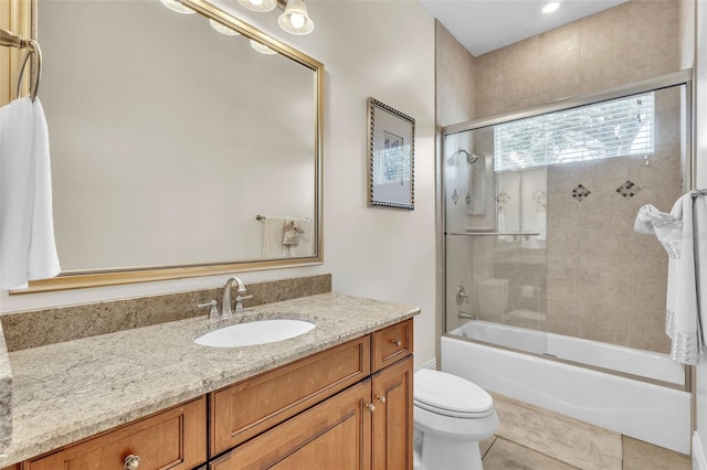 9729 Lake Hugh Dr, Gotha, FL 34734 - bathroom featuring vanity, toilet, and bath / shower combo with glass door