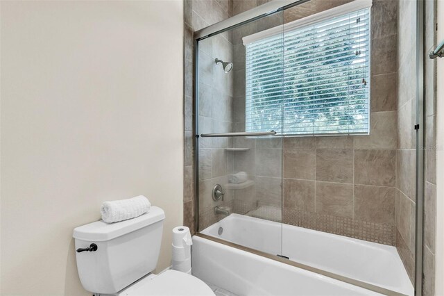 9729 Lake Hugh Dr, Gotha, FL 34734 - full bath with toilet and combined bath / shower with glass door