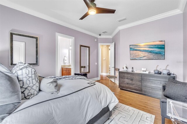 9729 Lake Hugh Dr, Gotha, FL 34734 - bedroom featuring crown molding, light wood-style flooring, a ceiling fan, connected bathroom, and baseboards