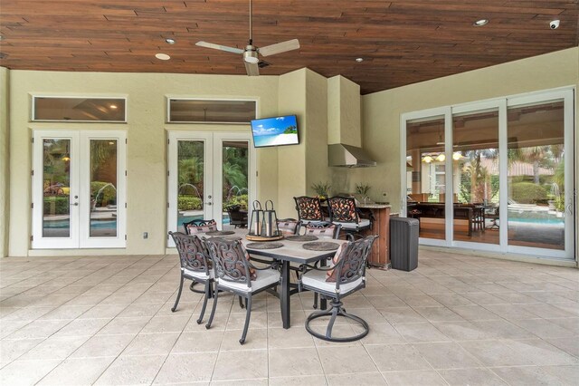 9729 Lake Hugh Dr, Gotha, FL 34734 - view of patio / terrace with french doors, a ceiling fan, and outdoor dining area