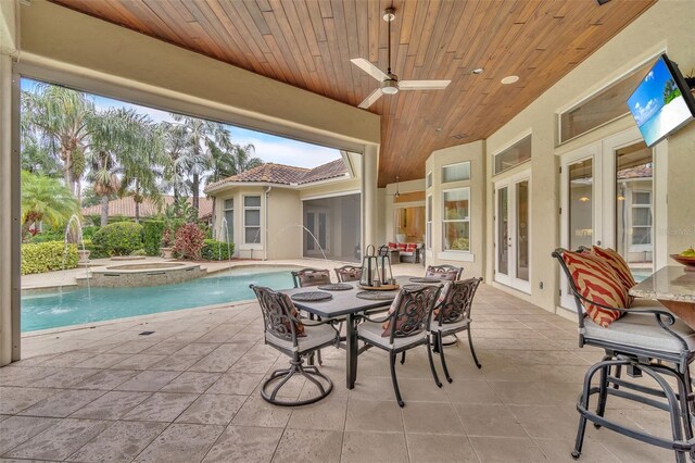 9729 Lake Hugh Dr, Gotha, FL 34734 - view of patio with french doors, ceiling fan, and a pool with connected hot tub