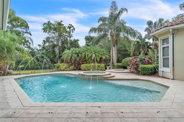 9729 Lake Hugh Dr, Gotha, FL 34734 - view of swimming pool with a pool with connected hot tub