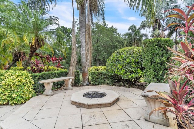 9729 Lake Hugh Dr, Gotha, FL 34734 - view of patio featuring an outdoor fire pit