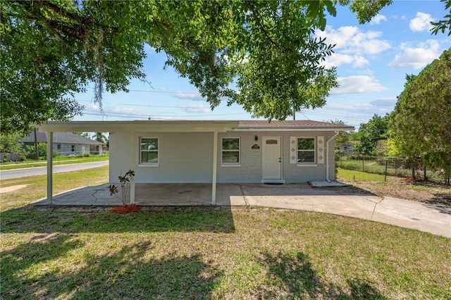 7701 Cassino Ave, Orlando, FL 32819 - view of front of house with a carport