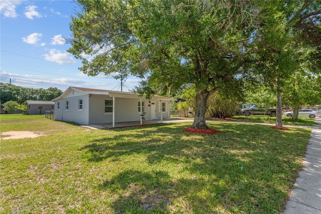 7701 Cassino Ave, Orlando, FL 32819 - view of green lawn with a patio