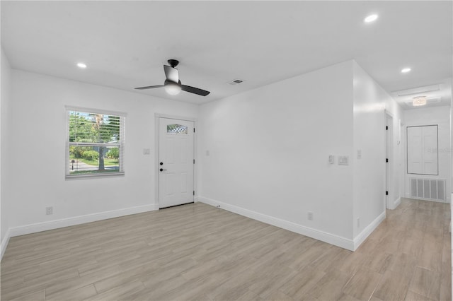 7701 Cassino Ave, Orlando, FL 32819 - foyer entrance with light wood-style flooring, ceiling fan, baseboards, and recessed lighting