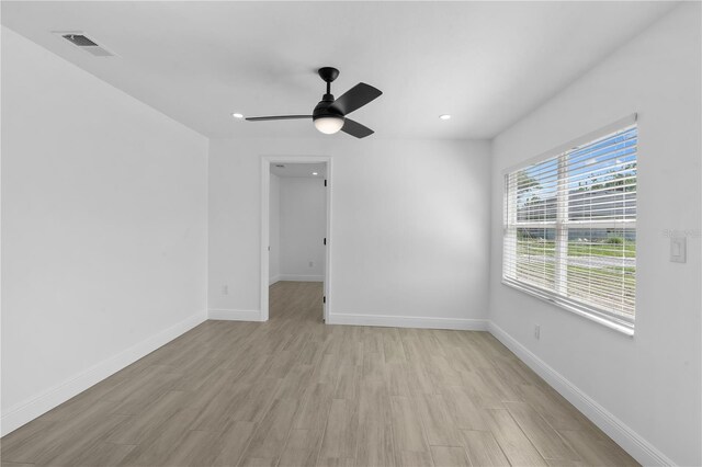 7701 Cassino Ave, Orlando, FL 32819 - spare room featuring light wood-style flooring, baseboards, a ceiling fan, and recessed lighting