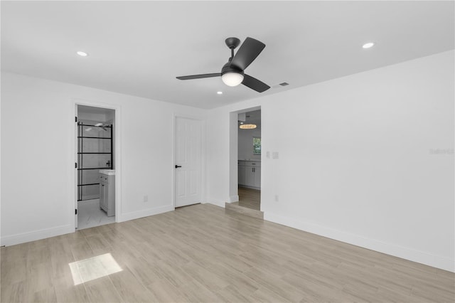 7701 Cassino Ave, Orlando, FL 32819 - unfurnished bedroom featuring recessed lighting, light wood-type flooring, baseboards, ensuite bathroom, and ceiling fan