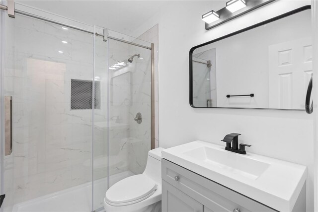 7701 Cassino Ave, Orlando, FL 32819 - bathroom with a marble finish shower, vanity, and toilet