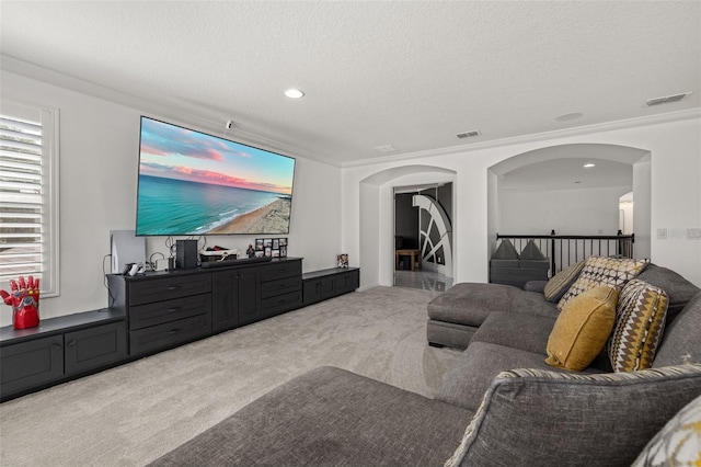 5365 Bowman Dr, Winter Garden, FL 34787 - living area with light colored carpet, arched walkways, recessed lighting, and a textured ceiling