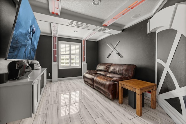 5365 Bowman Dr, Winter Garden, FL 34787 - living area with wood finish floors, baseboards, and a textured ceiling