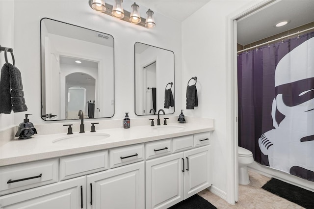 5365 Bowman Dr, Winter Garden, FL 34787 - full bathroom featuring double vanity, toilet, curtained shower, and tile patterned flooring