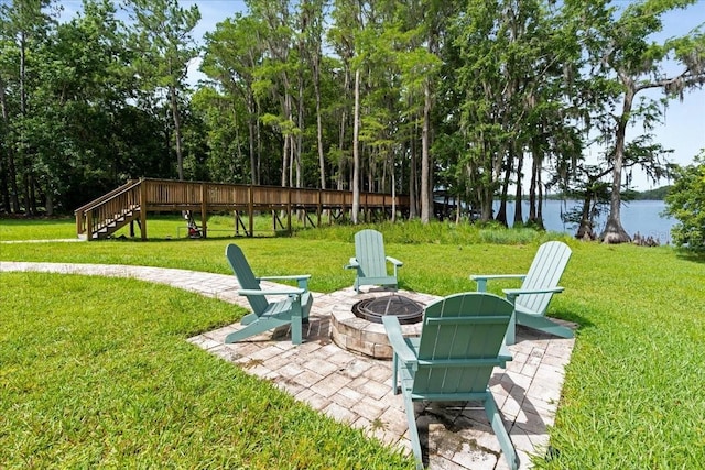 1550 Bluewater Run, Chuluota, FL 32766 - view of green lawn featuring a fire pit and a patio