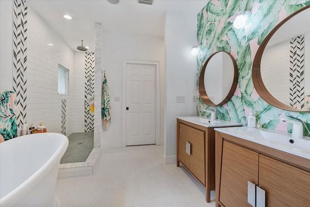 1550 Bluewater Run, Chuluota, FL 32766 - bathroom featuring a walk in shower, two vanities, and a freestanding tub