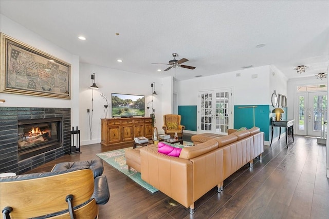 1550 Bluewater Run, Chuluota, FL 32766 - living room with french doors, recessed lighting, a ceiling fan, a glass covered fireplace, and dark wood-style floors