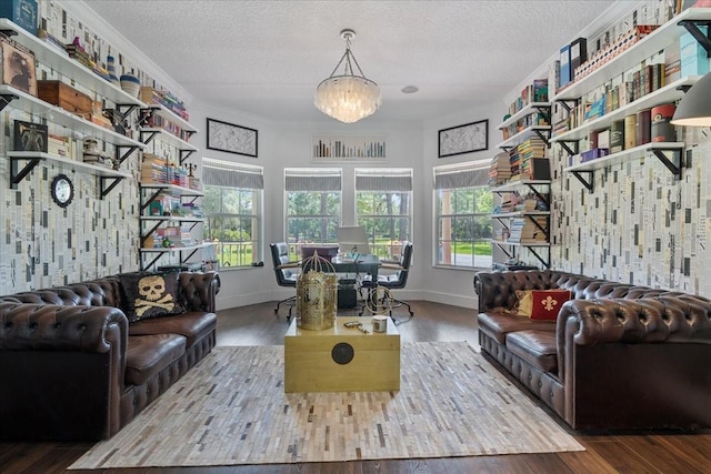 1550 Bluewater Run, Chuluota, FL 32766 - living room with plenty of natural light, wood finished floors, a textured ceiling, and a chandelier