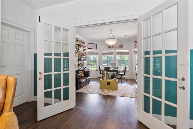 1550 Bluewater Run, Chuluota, FL 32766 - home office featuring dark wood-style flooring, a chandelier, and a textured ceiling