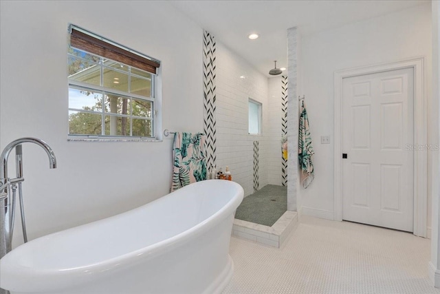 1550 Bluewater Run, Chuluota, FL 32766 - bathroom featuring tiled shower, a freestanding tub, and recessed lighting