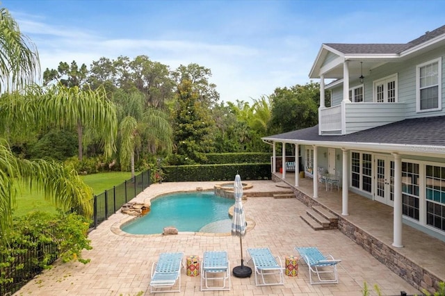 1550 Bluewater Run, Chuluota, FL 32766 - view of swimming pool with a fenced backyard, a patio, a pool with connected hot tub, and french doors