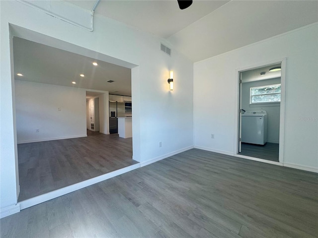 804 Starke Lake Cir, Ocoee, FL 34761 - empty room with washer / clothes dryer, wood finished floors, lofted ceiling, baseboards, and recessed lighting