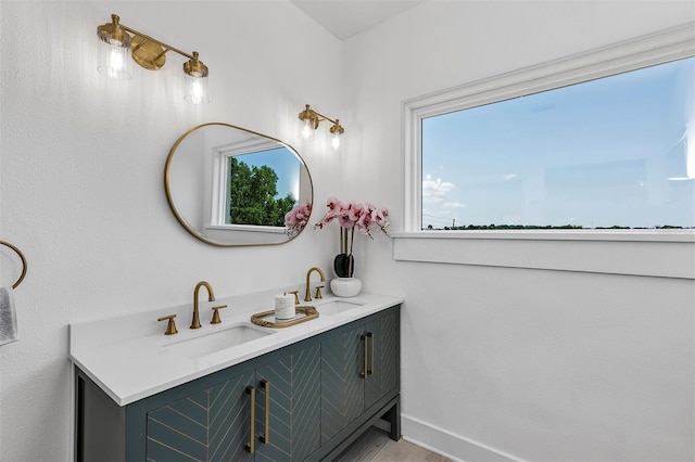 802 S 10th St, Haines City, FL 33844 - bathroom with double vanity and baseboards
