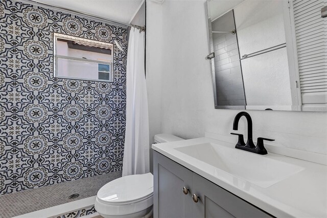 802 S 10th St, Haines City, FL 33844 - bathroom featuring vanity, toilet, and tiled shower