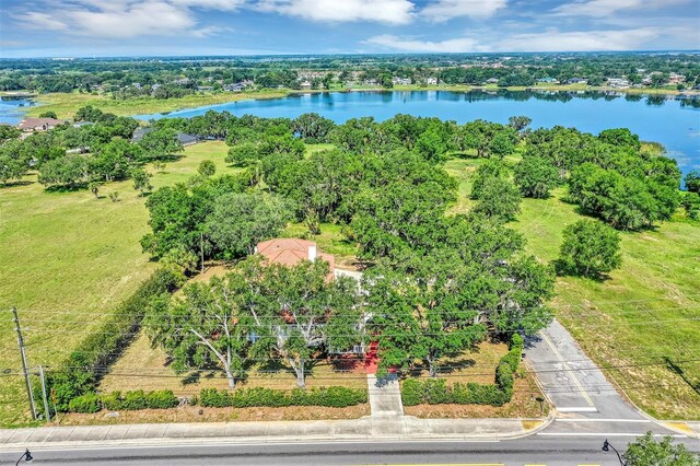 802 S 10th St, Haines City, FL 33844 - drone / aerial view of a nearby body of water and a tree filled landscape