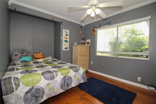 610 Heatherton Vlg Unit 610, Altamonte Springs, FL 32714 - bedroom with wood finished floors, crown molding, ceiling fan, and baseboards