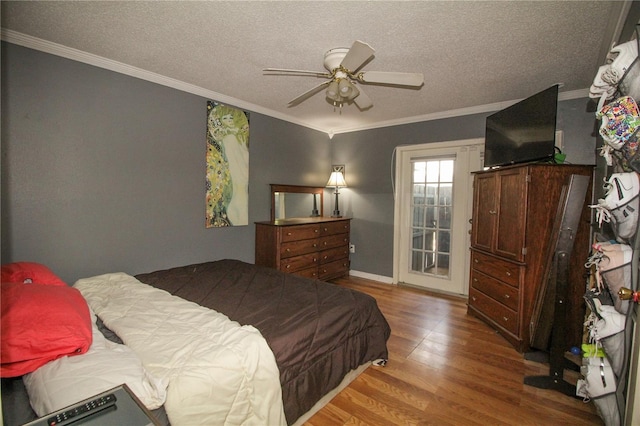 610 Heatherton Vlg Unit 610, Altamonte Springs, FL 32714 - bedroom featuring wood finished floors, crown molding, ceiling fan, a textured ceiling, and baseboards