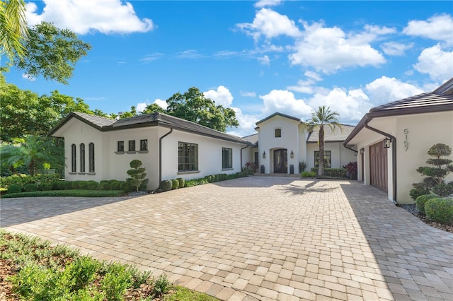 5157 Latrobe Dr, Windermere, FL 34786 - view of front of house with decorative driveway, stucco siding, and an attached garage