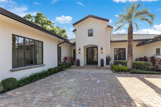 5157 Latrobe Dr, Windermere, FL 34786 - doorway to property featuring french doors and stucco siding