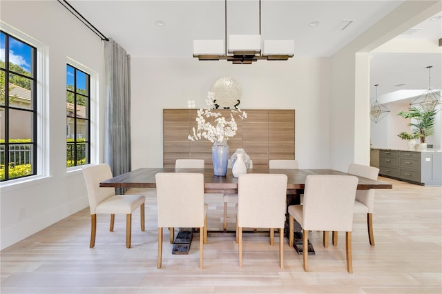 5157 Latrobe Dr, Windermere, FL 34786 - dining room with a chandelier and light wood-style floors