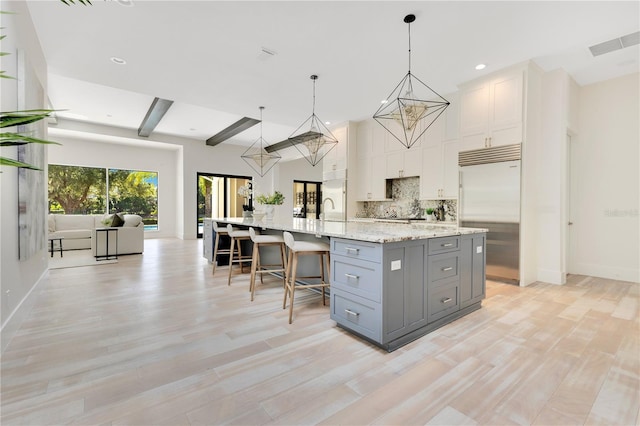 5157 Latrobe Dr, Windermere, FL 34786 - kitchen with stainless steel built in refrigerator, gray cabinets, tasteful backsplash, light wood-style floors, and recessed lighting