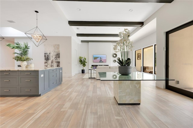 5157 Latrobe Dr, Windermere, FL 34786 - kitchen featuring gray cabinetry, light wood finished floors, beam ceiling, light stone counters, and a chandelier