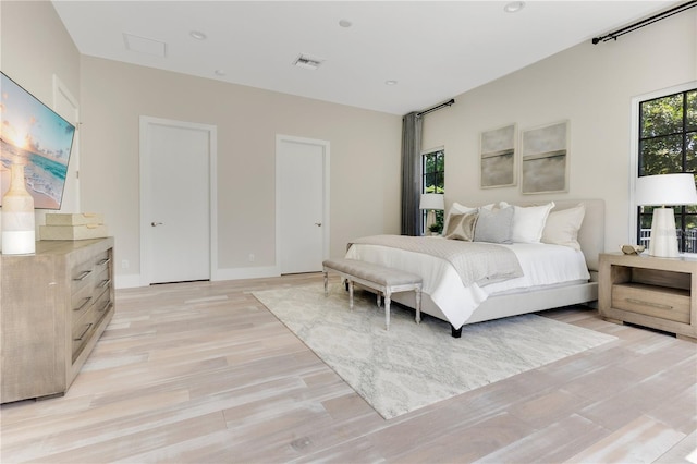 5157 Latrobe Dr, Windermere, FL 34786 - bedroom featuring light wood-style floors and baseboards
