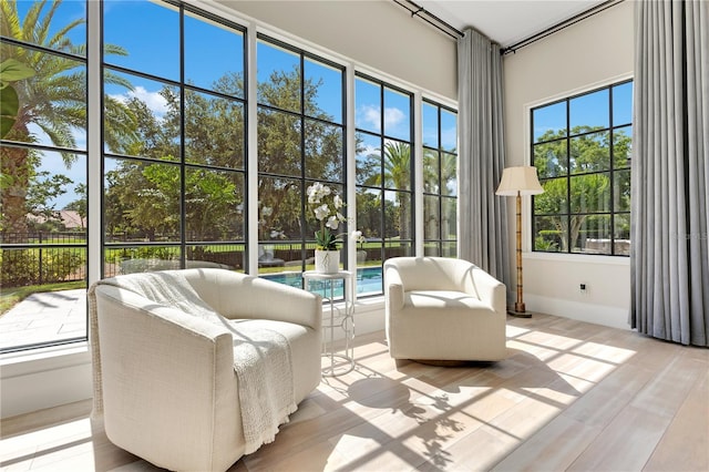 5157 Latrobe Dr, Windermere, FL 34786 - sunroom / solarium with healthy amount of natural light, wood finished floors, and baseboards