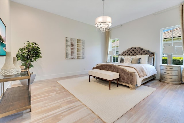 5157 Latrobe Dr, Windermere, FL 34786 - bedroom featuring a chandelier, wood finished floors, and baseboards