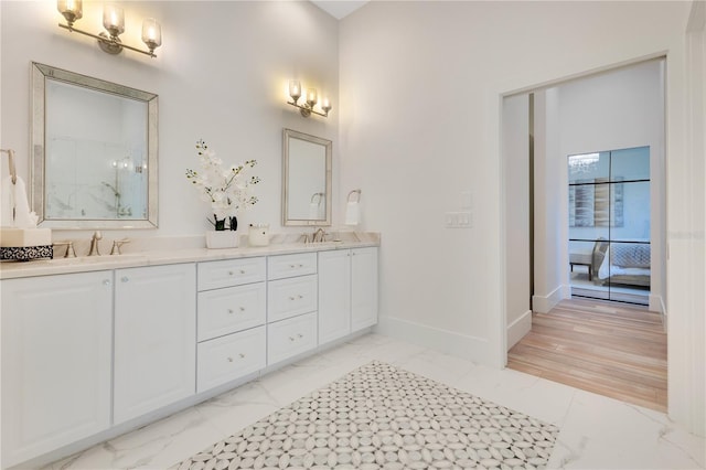 5157 Latrobe Dr, Windermere, FL 34786 - full bath featuring marble look tiles, double vanity, and baseboards