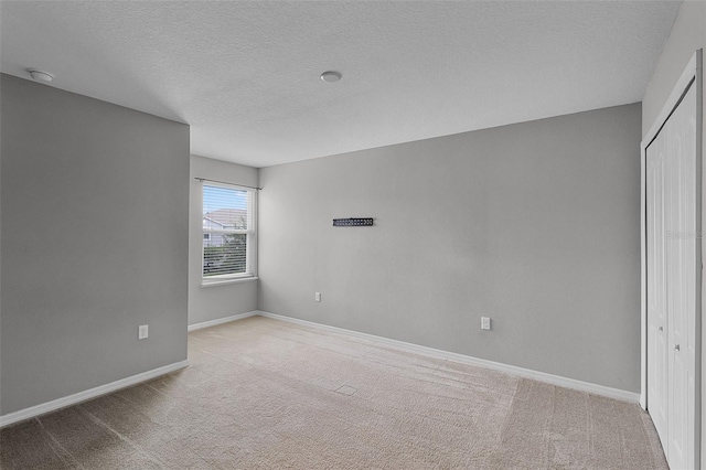 228 Primrose Dr, Davenport, FL 33837 - spare room with carpet flooring, baseboards, and a textured ceiling