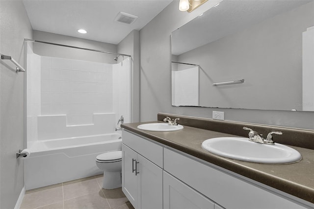 228 Primrose Dr, Davenport, FL 33837 - bathroom featuring double vanity, tile patterned floors, toilet, and shower / bathtub combination