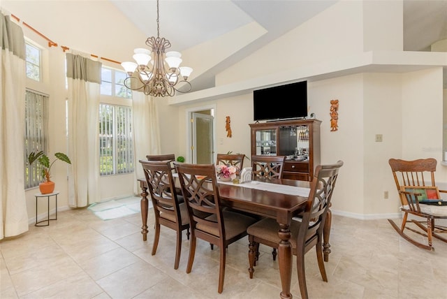 1910 Palm View Dr, Apopka, FL 32712 - dining area with high vaulted ceiling, a chandelier, light tile patterned floors, and baseboards