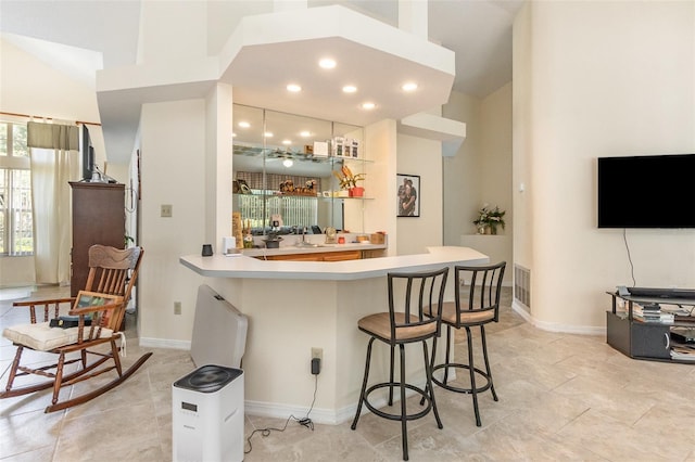 1910 Palm View Dr, Apopka, FL 32712 - indoor wet bar featuring high vaulted ceiling, baseboards, and recessed lighting